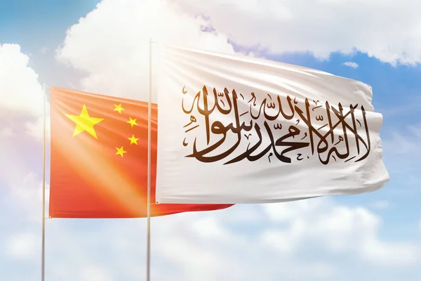 Sunny blue sky and flags of afghanistan and china