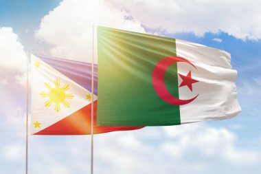Sunny blue sky and flags of algeria and philippines