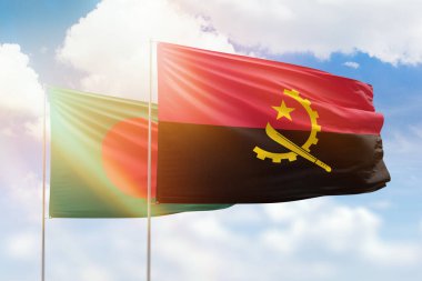 Sunny blue sky and flags of angola and bangladesh