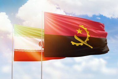 Sunny blue sky and flags of angola and iran
