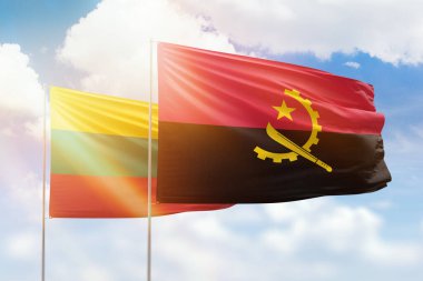 Sunny blue sky and flags of angola and lithuania
