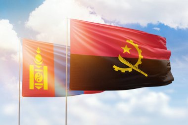 Sunny blue sky and flags of angola and mongolia