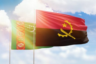 Sunny blue sky and flags of angola and turkmenistan
