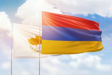 Sunny blue sky and flags of armenia and cyprus