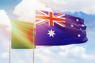 Sunny blue sky and flags of australia and algeria