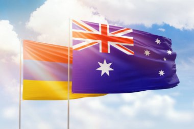 Sunny blue sky and flags of australia and armenia