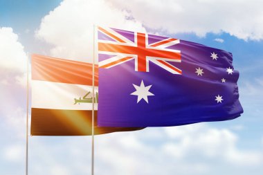 Sunny blue sky and flags of australia and iraq