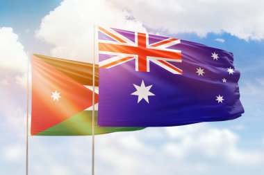 Sunny blue sky and flags of australia and jordan