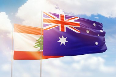 Sunny blue sky and flags of australia and lebanon