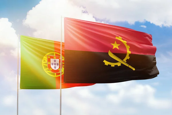 Sunny Blue Sky Flags Angola Portugal — стоковое фото