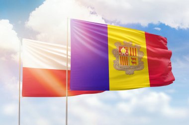Sunny blue sky and flags of andorra and poland