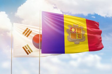 Sunny blue sky and flags of andorra and south korea