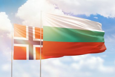 Sunny blue sky and flags of bulgaria and norway