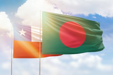 Sunny blue sky and flags of bangladesh and chile