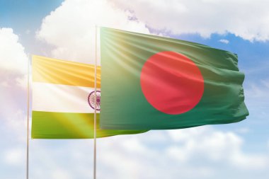 Sunny blue sky and flags of bangladesh and india