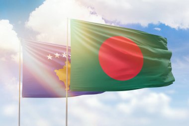 Sunny blue sky and flags of bangladesh and kosovo