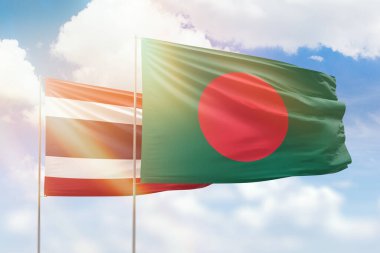 Sunny blue sky and flags of bangladesh and thailand