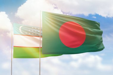 Sunny blue sky and flags of bangladesh and uzbekistan