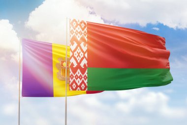 Sunny blue sky and flags of belarus and andorra