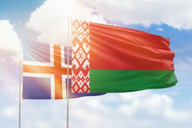 Sunny blue sky and flags of belarus and iceland