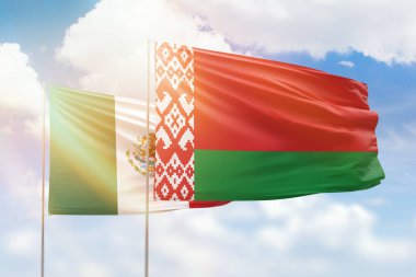 Sunny blue sky and flags of belarus and mexico