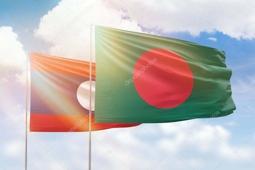 Sunny blue sky and flags of bangladesh and laos