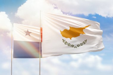 Sunny blue sky and flags of cyprus and panama