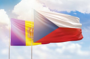 Sunny blue sky and flags of czechia and andorra