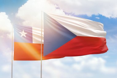 Sunny blue sky and flags of czechia and chile