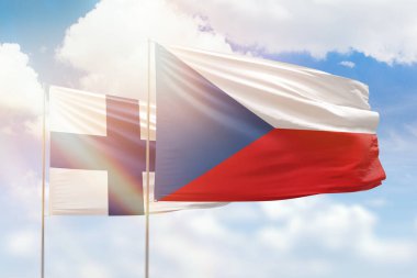 Sunny blue sky and flags of czechia and finland