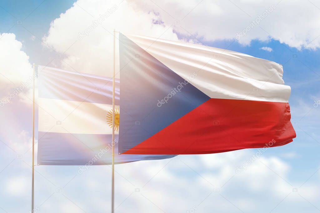 Sunny blue sky and flags of czechia and argentina
