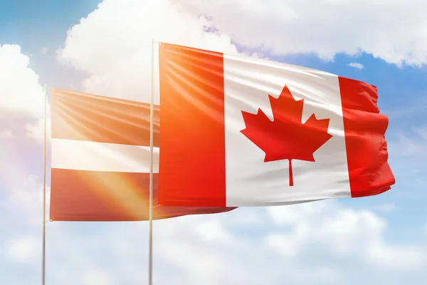 Sunny Blue Sky Flags Canada Latvia — Zdjęcie stockowe