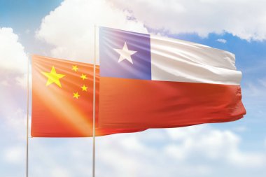 Sunny blue sky and flags of chile and china