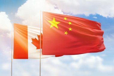 Sunny blue sky and flags of china and canada