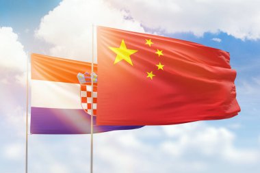 Sunny blue sky and flags of china and croatia