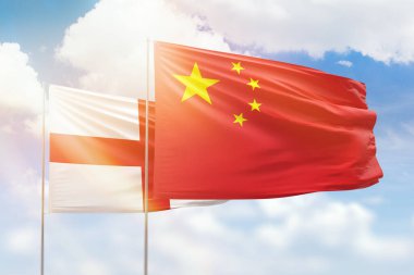 Sunny blue sky and flags of china and england