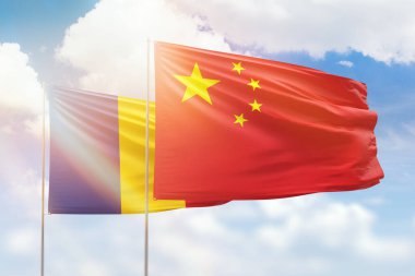Sunny blue sky and flags of china and romania