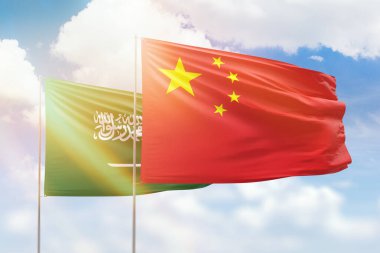 Sunny blue sky and flags of china and saudi arabia