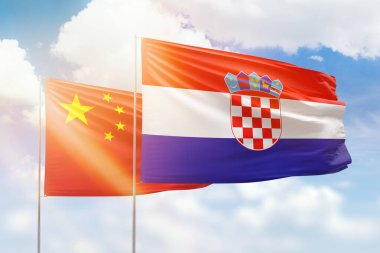 Sunny blue sky and flags of croatia and china