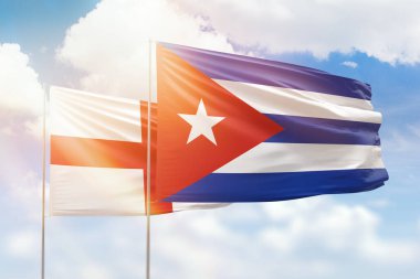 Sunny blue sky and flags of cuba and england
