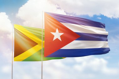 Sunny blue sky and flags of cuba and jamaica