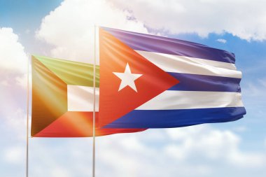 Sunny blue sky and flags of cuba and kuwait