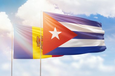 Sunny blue sky and flags of cuba and moldova