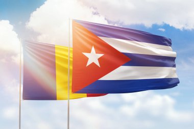Sunny blue sky and flags of cuba and romania