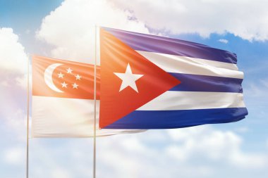Sunny blue sky and flags of cuba and singapore
