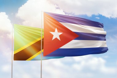 Sunny blue sky and flags of cuba and tanzania