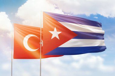Sunny blue sky and flags of cuba and turkey