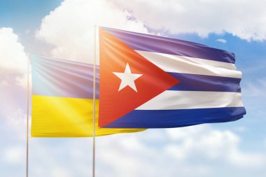 Sunny blue sky and flags of cuba and ukraine