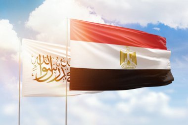 Sunny blue sky and flags of egypt and afghanistan