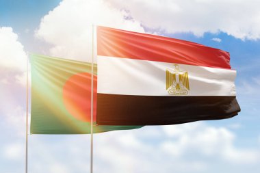 Sunny blue sky and flags of egypt and bangladesh